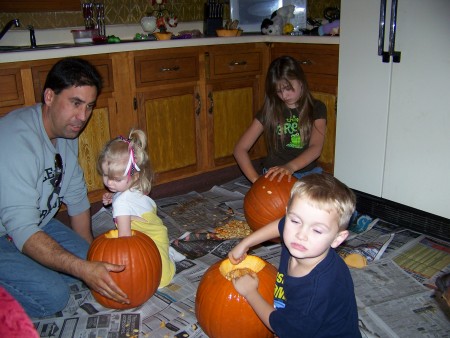 The family carving pumpkins