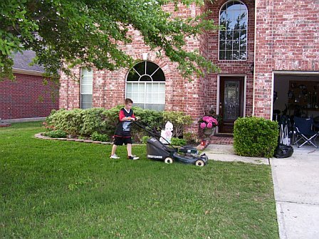 Ryan mowing the front yard