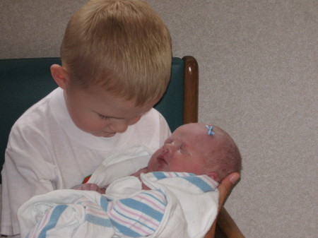 Jackson holding "brand new" sister as he says!