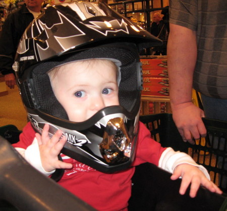 Rachel trying on helmet at Cabela's