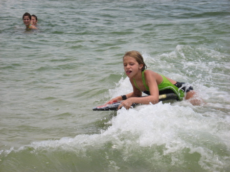 Paige catching a wave