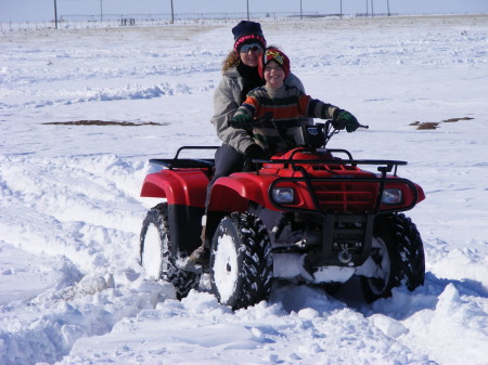 Sons wife and one of twins playing,in snow.