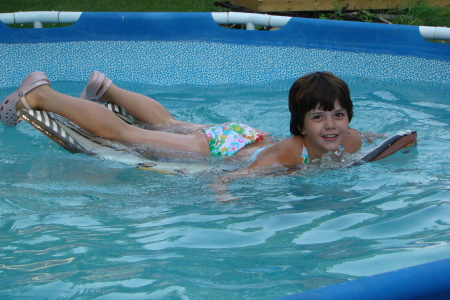 Maya in the back yard pool