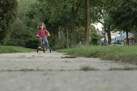 Catcher riding up the sidewalk.