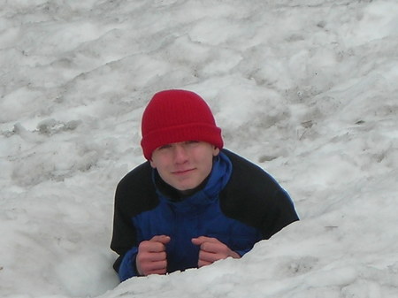 My younger son buried in snow at our timeshare