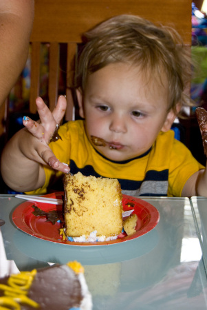 dylan trying to wipe them off on the cake