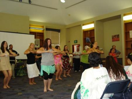 The women hula for the kids.