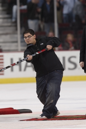 TJ Shoots the puck at a Blackhawks Game