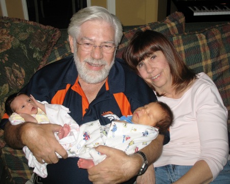 Steve & Ann holding their new twin grandkids