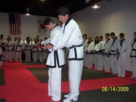 Son Bradon 14 receiving his black belt