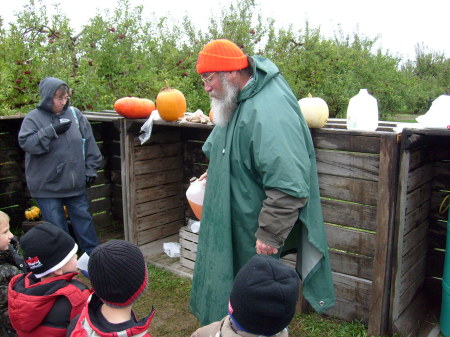 Some strange man at a pumpkin patch.