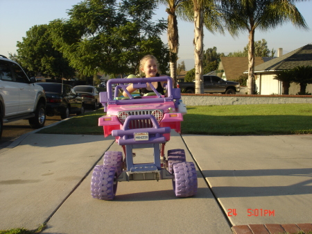 Tori riding her modified Barbie Jeep