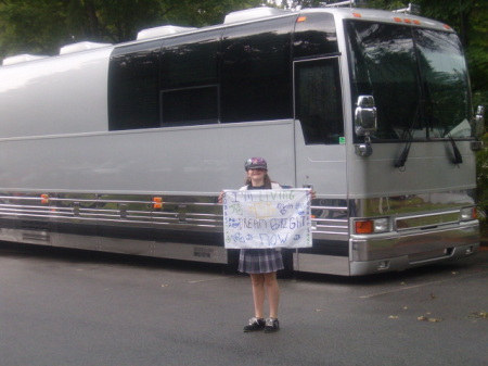 sarah in front of the jonas brother bus