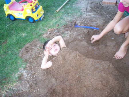 Ryan burried in the sand