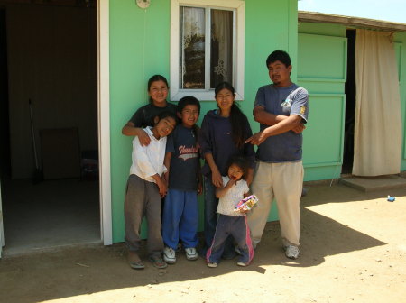 Marco Rosa & family in front of their new home