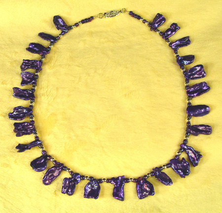 Freshwater pearls dyed deep purple