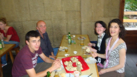 Eating Khinkali (see on tray) at restaurant