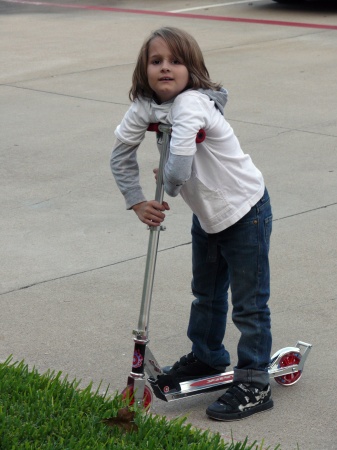 Seth loves his scooter!