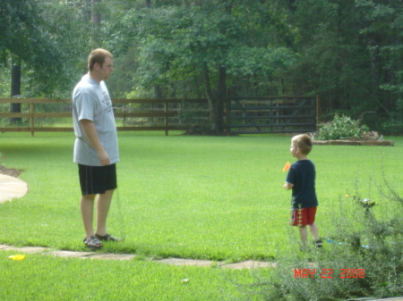 Dave teaching Jake to golf in Texas