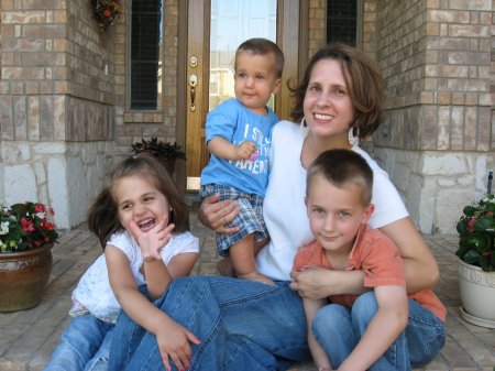 The kids and Michalann on the front porch