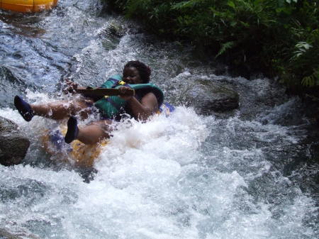 Daughter splashing down the Jamaican river