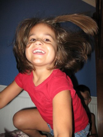 Claire jumping off of the bunk bed