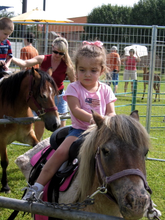 Aubrey riding the pony on 4th of July 2008.