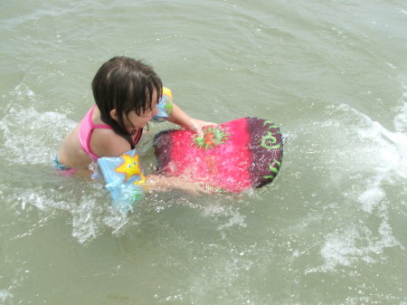 Elaina catching a wave