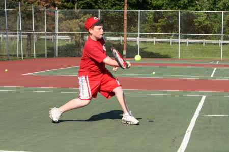 My boy 11, in action at tennis camp.