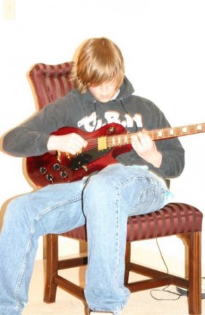 Shane playing guitar--love of his life