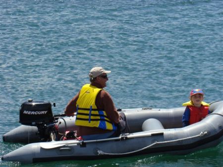 Dad taking boys out in Dingy