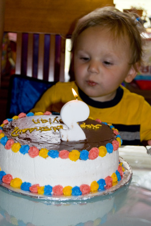 dylan trying to blow out candle