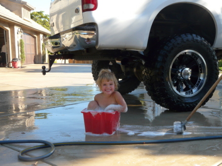 Our baby girl helping wash the truck!!