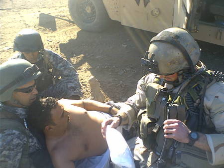 team leader jim treating iraqi wounded