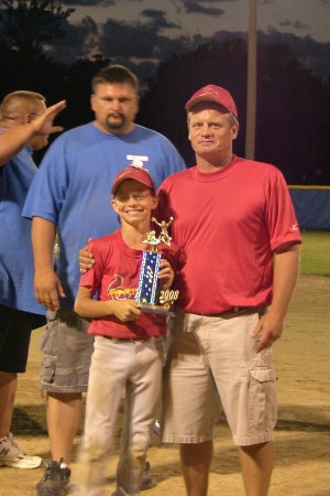 Cody Robinson 1st place trophy with Coach