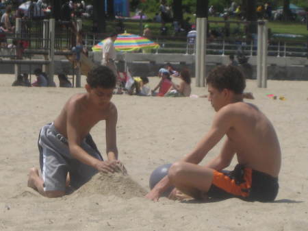 Boys at play lifes a beach