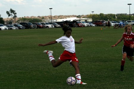 Erica passing the ball to a teammate