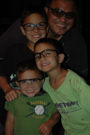 The Aquino men in safety glasses.