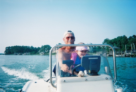 Caroline driving Papa's boat!