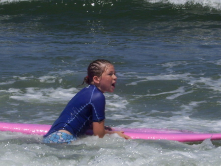 sarah surfing at Rat beach