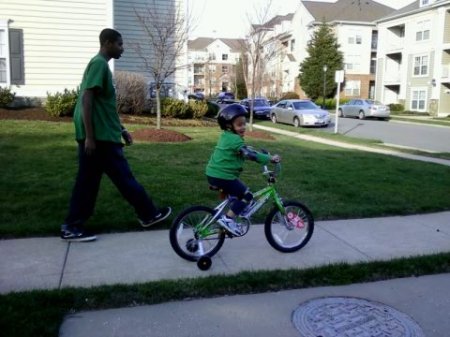 Corey riding his bike to the park