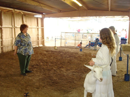 Marie in the ring with her Champion dairy goat.