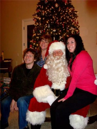 My son and daughter with me and Santa(my dad)