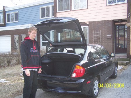 My son with his first car