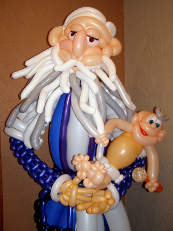 close-up of Father Time and Baby New Year.