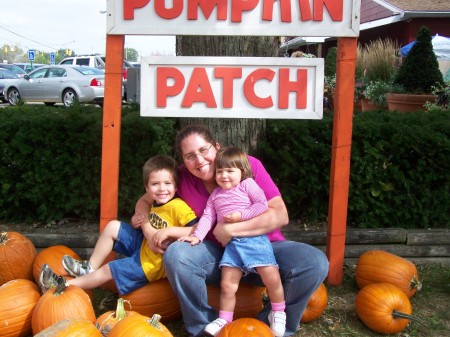 Mommy & kids picking pumpkins