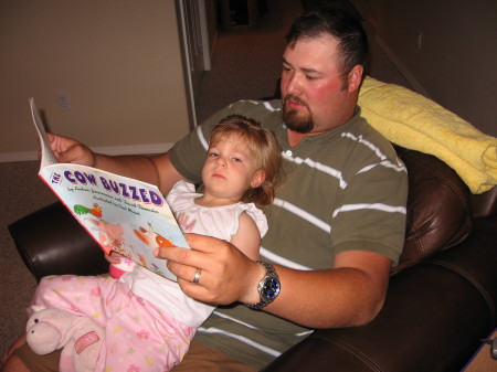 Derek reading to Mykah.