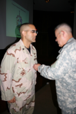 Medal presentation by MGen Helmly (US Army)