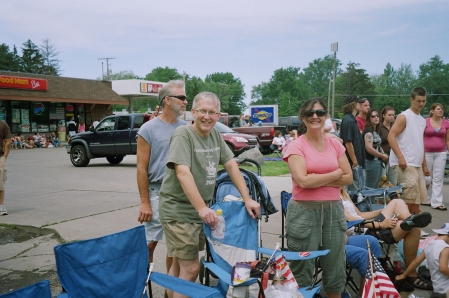 husband and friends at daughter's parade