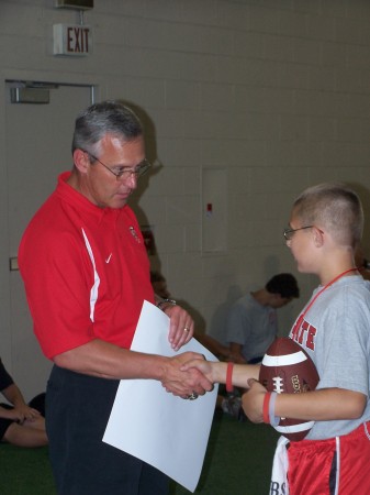 Justin with Jim Tressel at football camp 2006